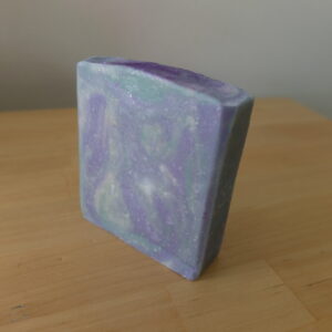 Square soap with swirls of green and gold