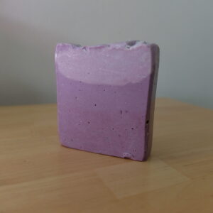 A square soap with 3 layers of subtly different shades of lilac.